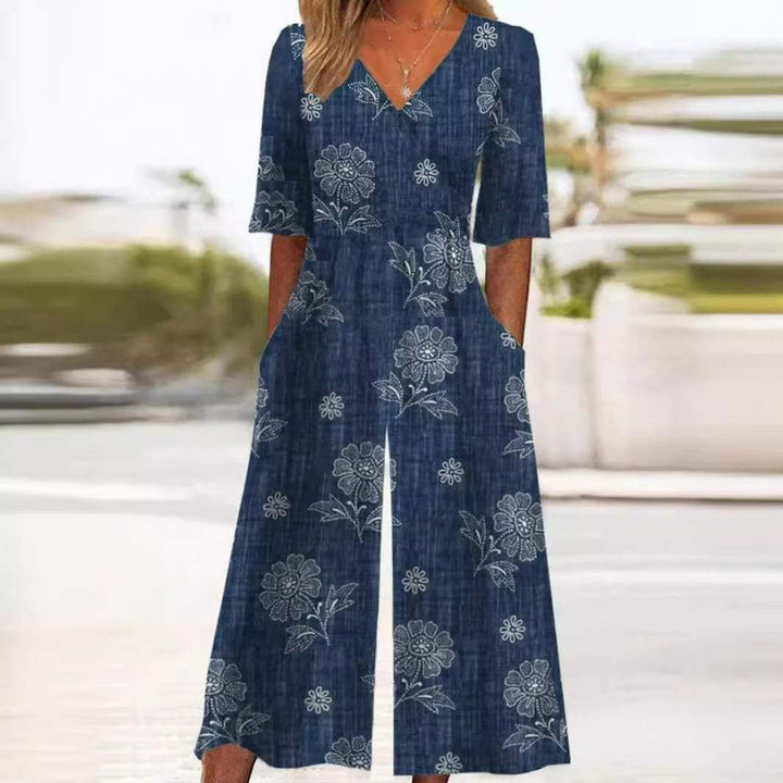 Eleganter Damen Boho Jumpsuit mit Blumenmuster, V-Ausschnitt & weitem Bein. Perfekt für Sommer & Urlaub.