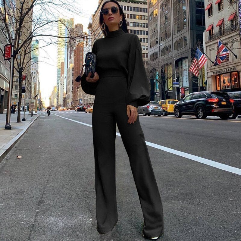 Gelber Damen Jumpsuit, elegant mit Puffärmeln & weitem Bein, ein Statement-Piece für moderne Frauen und besondere Events.