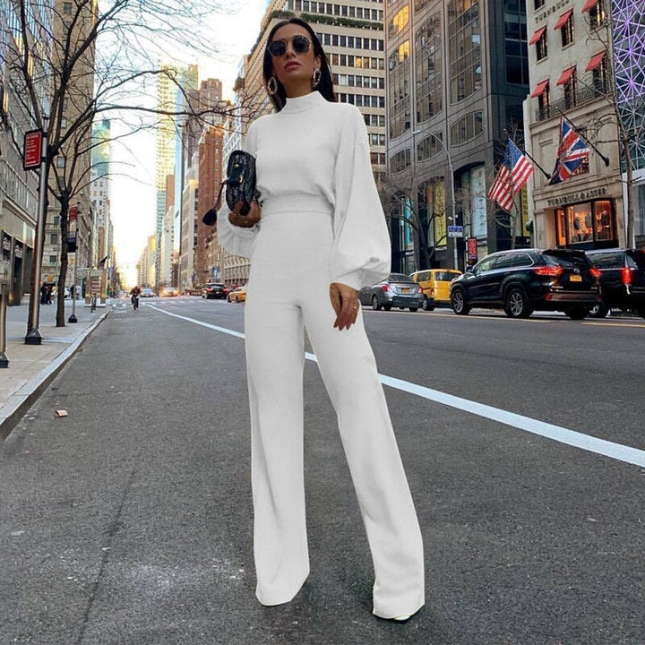 Weißer eleganter Damen Jumpsuit mit schicken Puffärmeln & weitem Bein, ideal für Sommerpartys, Feiern & urbane Looks.