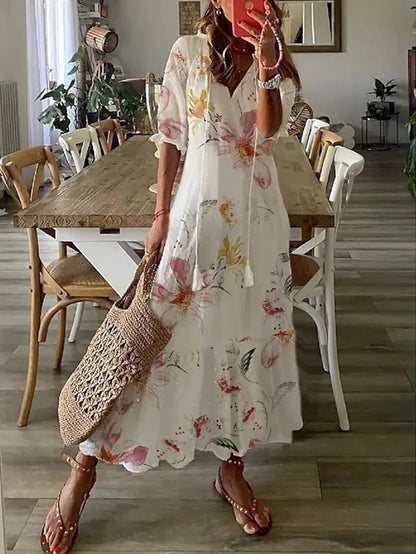 Fließendes Damen Midikleid mit luftigem Stoff, Boho-Muster, V-Ausschnitt & 3/4 Ärmeln. Bequem & stylisch für den Sommer.