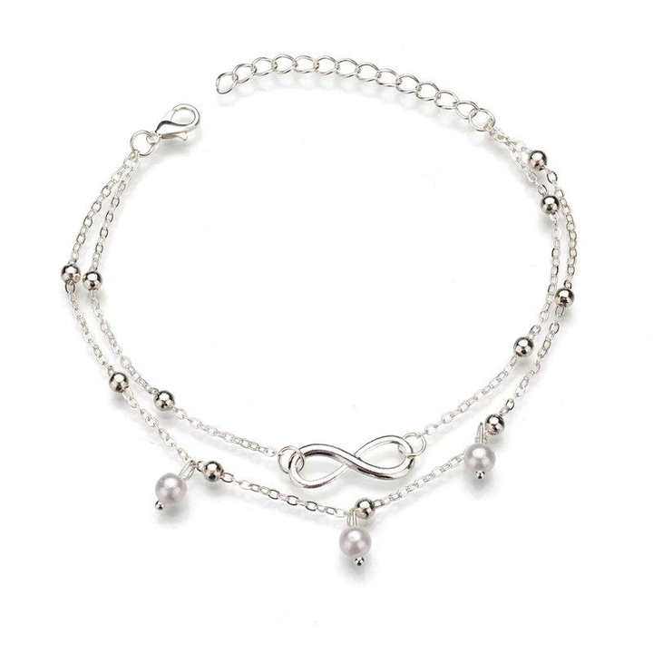 Stilvolles Damen Fußkettchen mit Retro-Perlen und Unendlichkeitssymbol. Perfektes Geschenk oder Sommer-Accessoire.