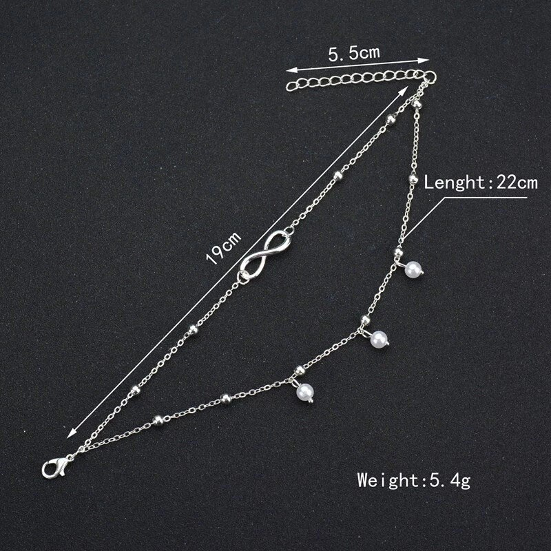 Perlen-Fußkettchen im Retro-Stil für Damen. Mit zartem Unendlichkeits-Symbol, ein zeitloses Sommer-Accessoire.