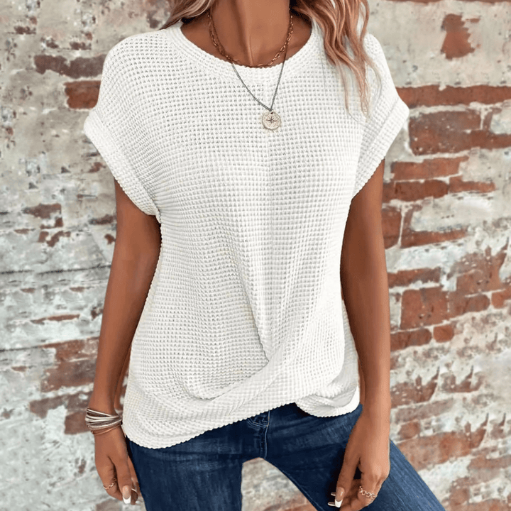 Elegante Damen-Kurzarmbluse mit lockerer Passform und moderner weiter Silhouette. Ideal für Alltag & Anlässe.