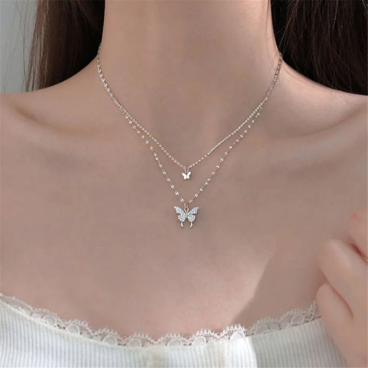 Elegantes Damen Schmetterling Halsketten-Set aus glänzendem Silber mit funkelnden Zirkonsteinen.