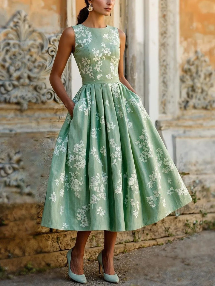 Damen Fit-and-Flare Midikleid mit floralem Muster und schwingendem Plisseerock. Ideal als Sommer- oder Partykleid.