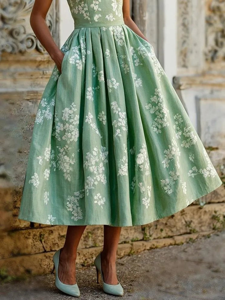 Blumen Midikleid für Damen mit Plisseerock. Stilvolles Sommerkleid, Partykleid oder Abendkleid mit Rundhals.