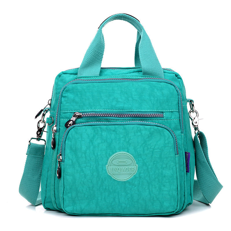 Schwarze, wasserfeste Damen 3-in-1 Tasche: Elegant als Umhängetasche, Schultertasche oder Rucksack.