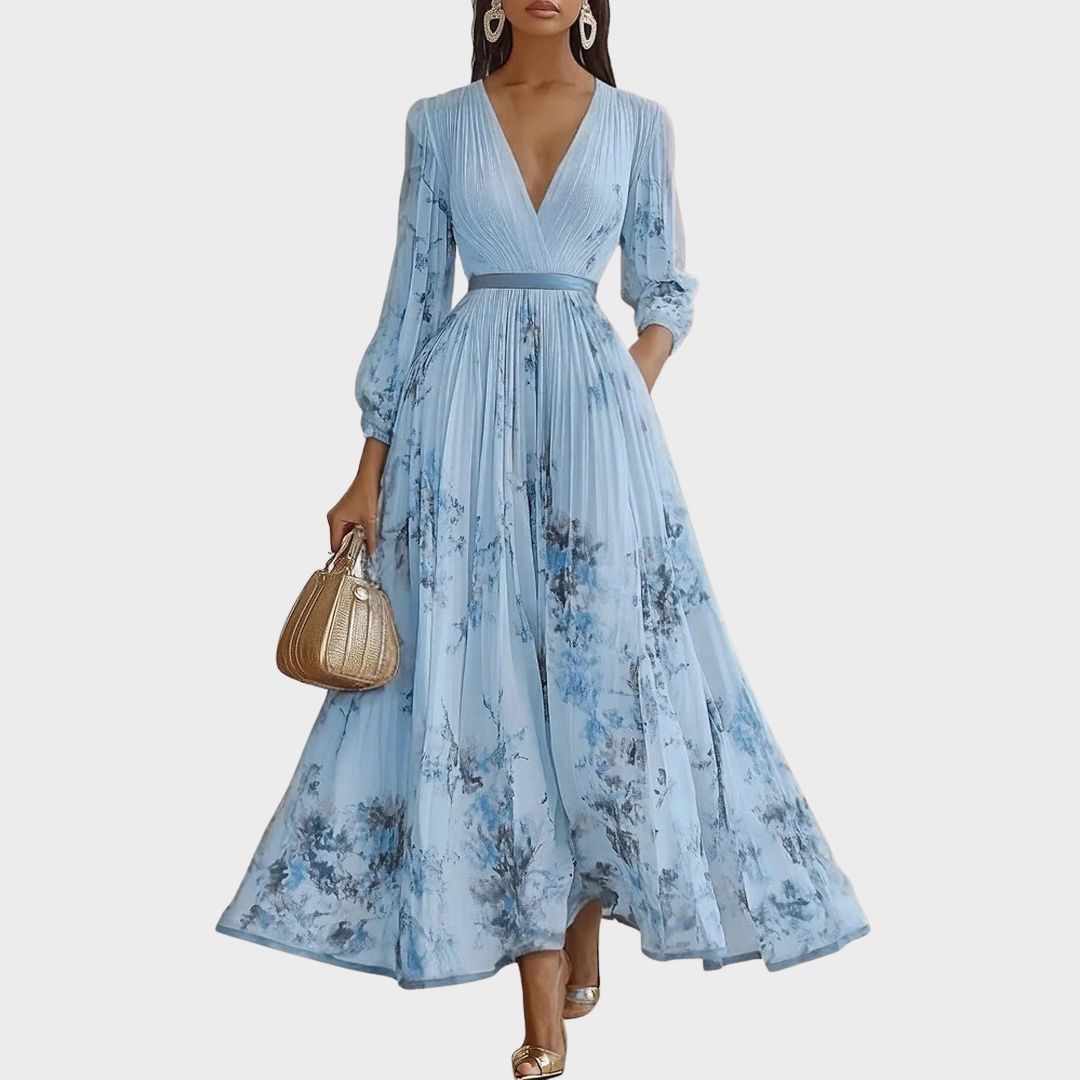 Sommerliches Damenkleid, ärmellos & plissiert. Midi-Länge mit schönem Blumenmuster.