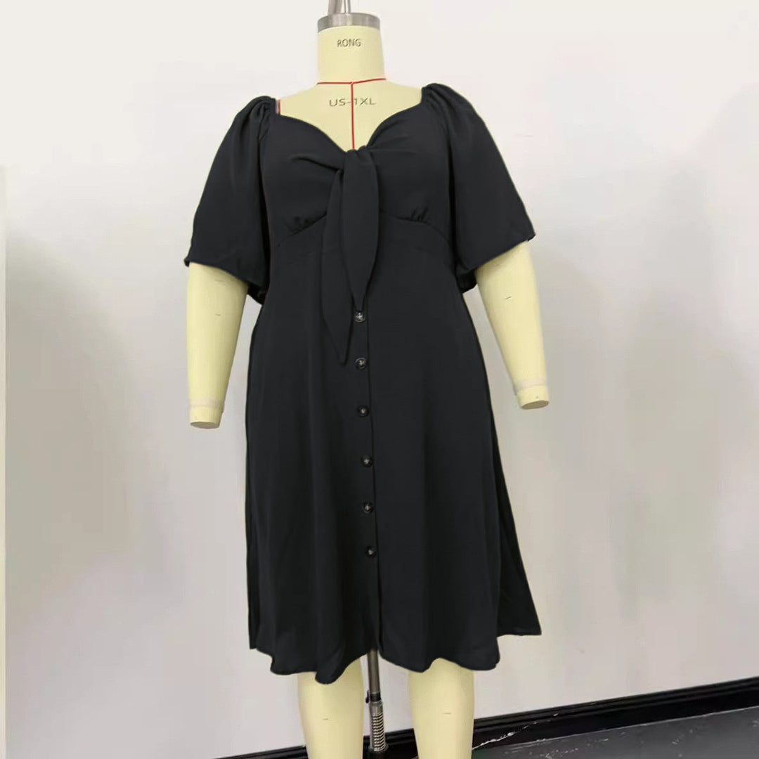 Modernes Damenkleid mit Puffärmeln und Knoten-Detail. Ein vielseitiges A-Linien Midikleid mit Knopfleiste.
