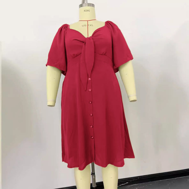 Schickes Damen Midikleid in A-Linie, perfekt für festliche Anlässe oder das Büro. Mit Puffärmeln & Knotendetail.
