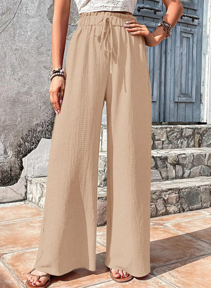 Entspannte Damen-Palazzohose für Zuhause oder Urlaub. Leichter Stoff, hoher Gummibund & verstellbarer Kordelzug.