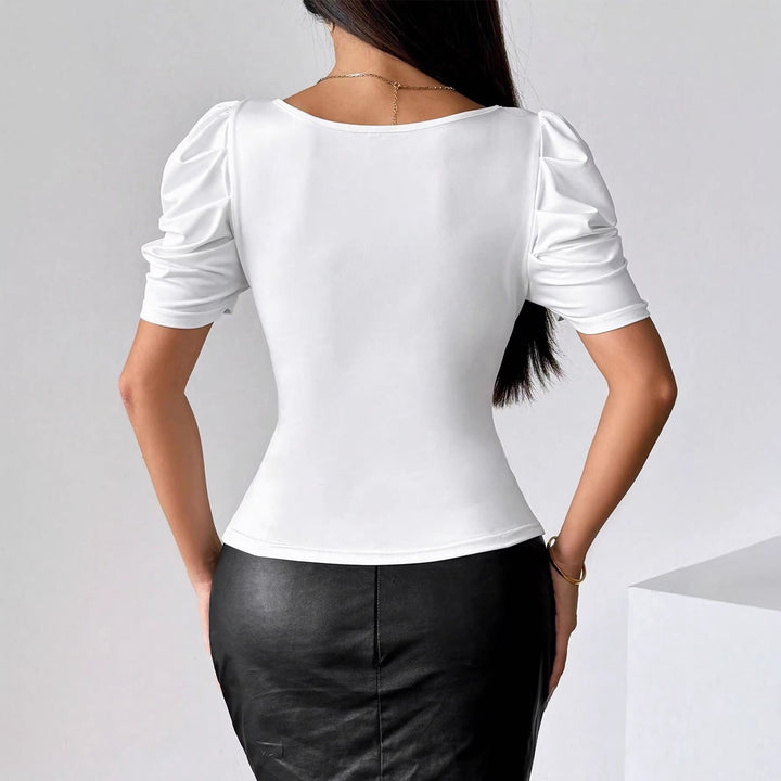 Modisches, figurbetontes Damen Top mit Corsagen-Details, stilvollen Puffärmeln und femininem Herzausschnitt.