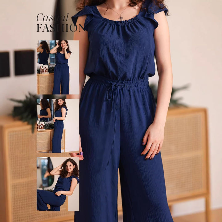 Eleganter Damen Crinkle-Overall in Schwarz, mit weitem Bein, Rüschenärmeln, perfekt für warme Tage.