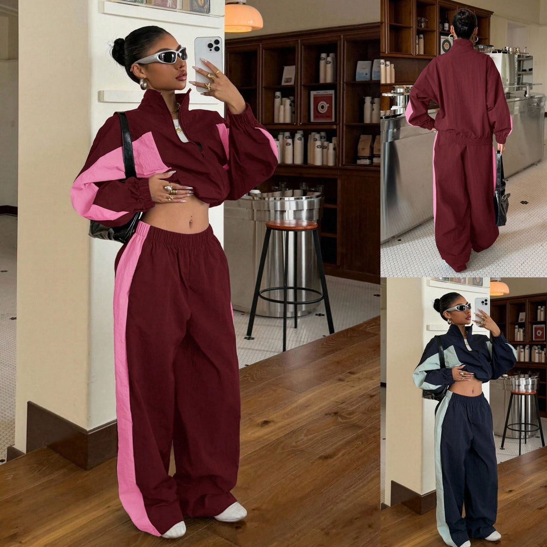 Damen Trackset mit Crop-Jacke und weiter Jogginghose, Kontraststreifen, ideal für Sport und Freizeit.