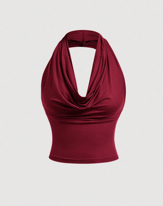 Kurzes Damen Neckholder-Top mit Wasserfall-Ausschnitt. Elegant, figurbetont & modisch, ideal für sommerliche Partys.