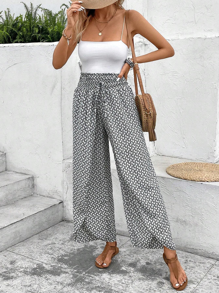 Damen Palazzo-Hose mit grafischem Muster, weitem Bein & elastischem Bund. Modische Sommerhose.