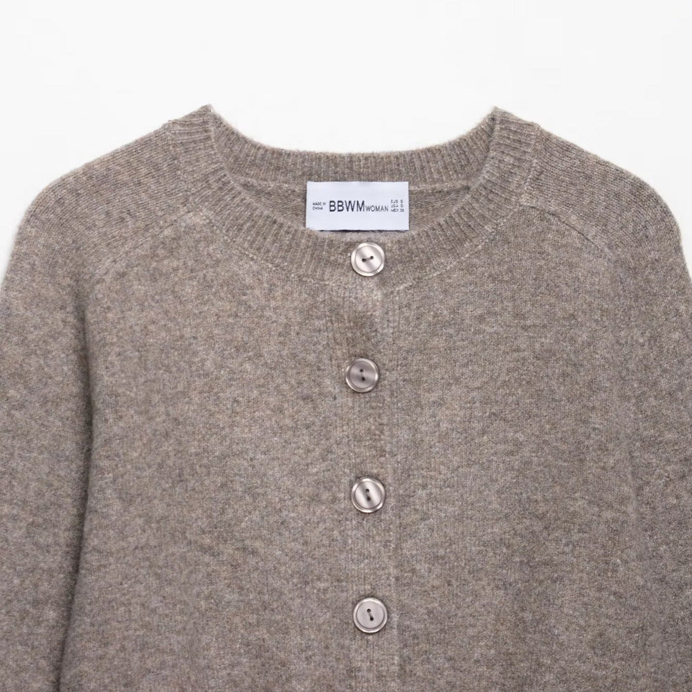 Modische Damen Kurzstrickjacke, perfekt für Business Casual und elegante Freizeitmode im Frühling/Sommer.