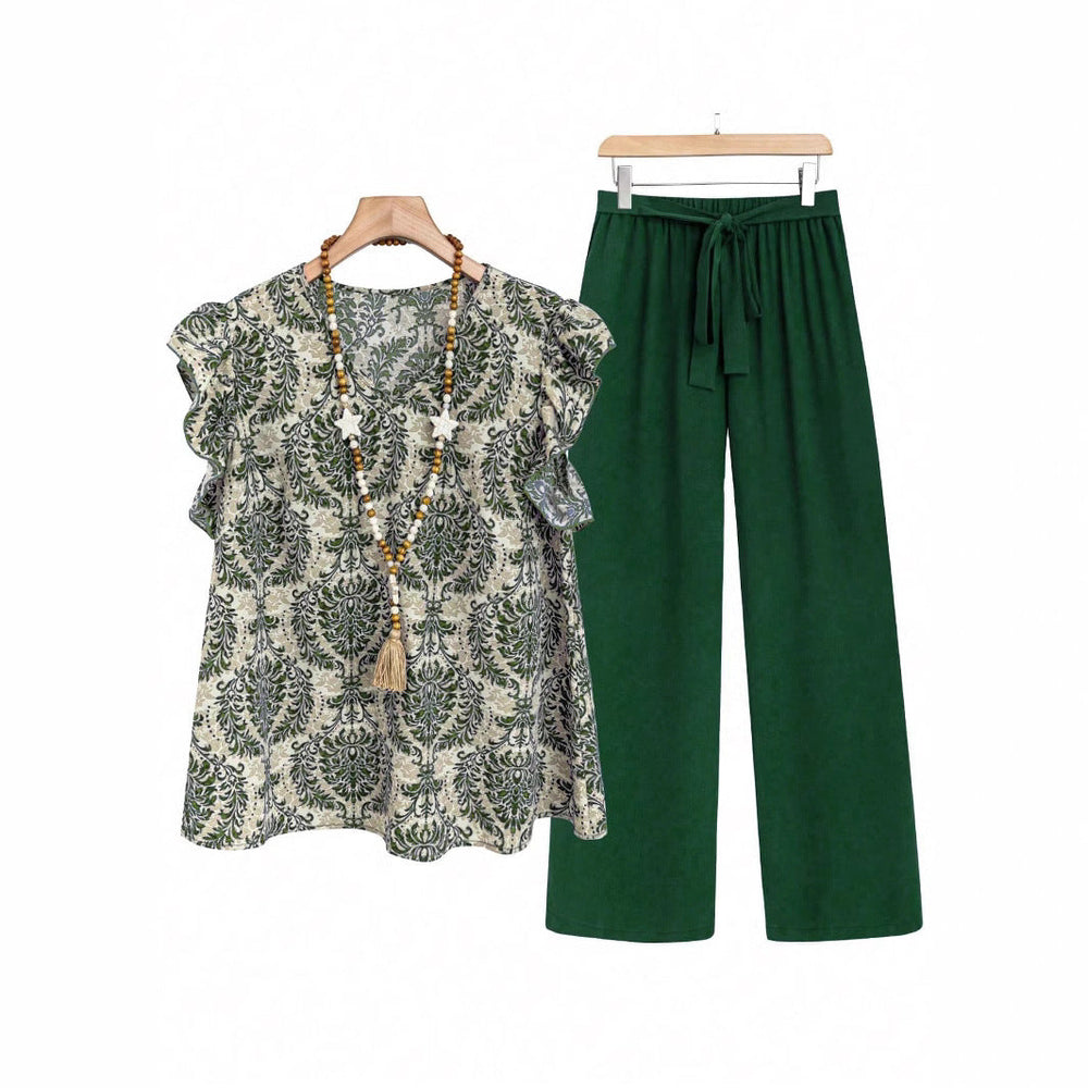 Modisches Damen Outfit: fließende Printbluse mit Blumenmuster & weite Hose. Perfekt für Büro & Freizeit.