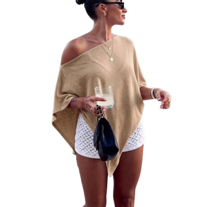 Modisches Damen Übergangstop, asymmetrischer Off-Shoulder Poncho-Stil, locker sitzend, vielseitig kombinierbar.