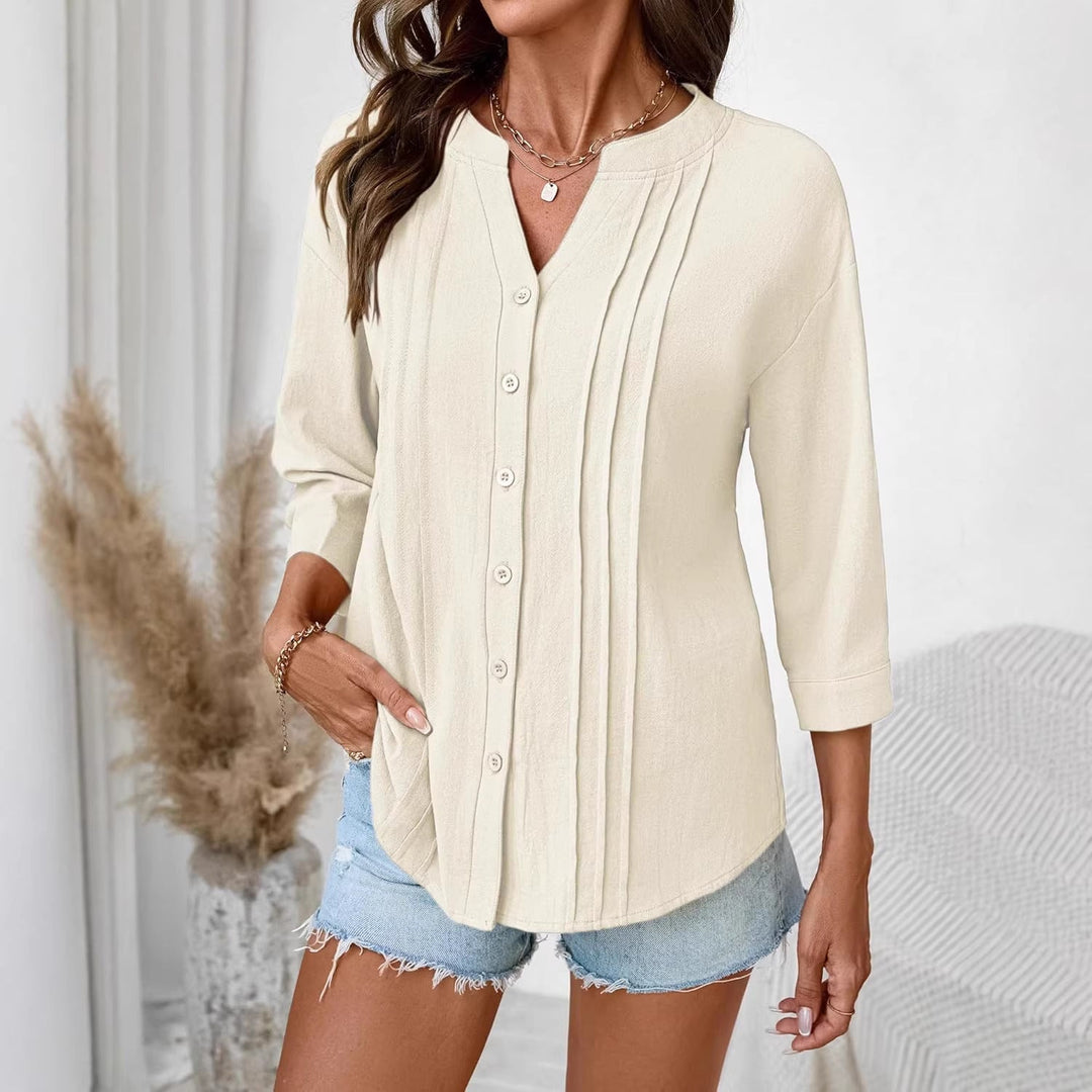 Elegantes Damen Oberteil: lockere Tunika mit Kellerfalten & Dreiviertelärmeln. Perfekt für Frühlingsmode.