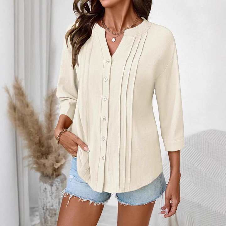 Elegantes Damen Oberteil: lockere Tunika mit Kellerfalten & Dreiviertelärmeln. Perfekt für Frühlingsmode.