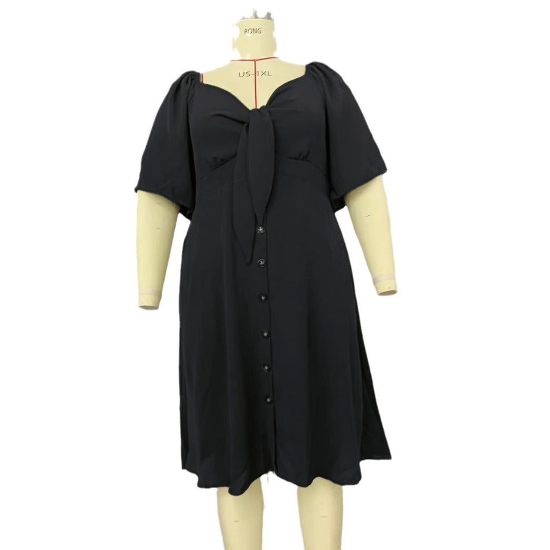 Feminines A-Linien Midikleid für Damen mit charmanten Puffärmeln, Knoten-Detail & Knopfleiste. Für viele Anlässe.