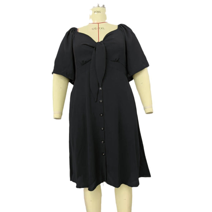 Feminines A-Linien Midikleid für Damen mit charmanten Puffärmeln, Knoten-Detail & Knopfleiste. Für viele Anlässe.