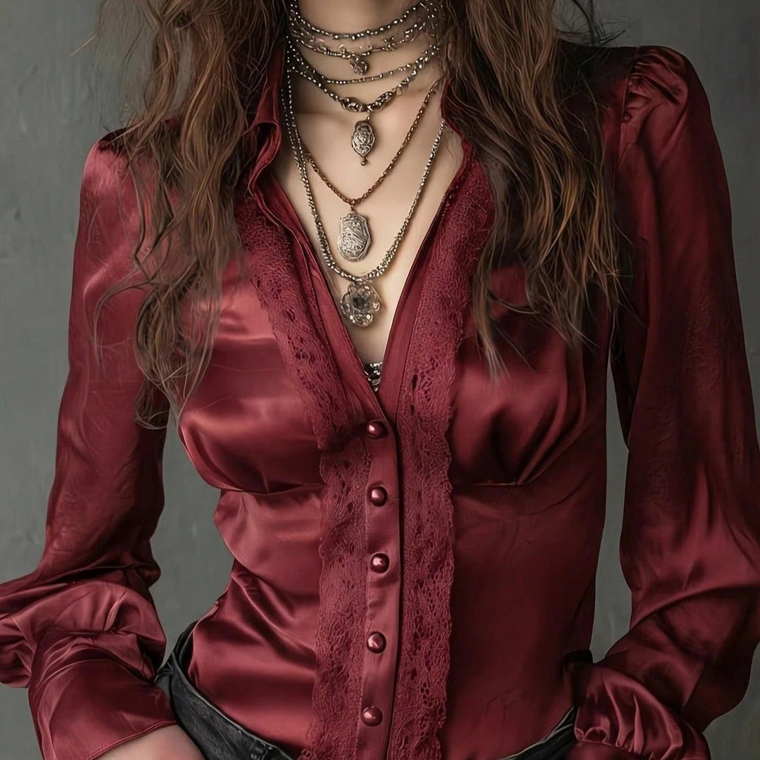 Taillierte Damenbluse mit Knopfleiste und femininen Puffärmeln. Ein elegantes Oberteil für Damenmode.