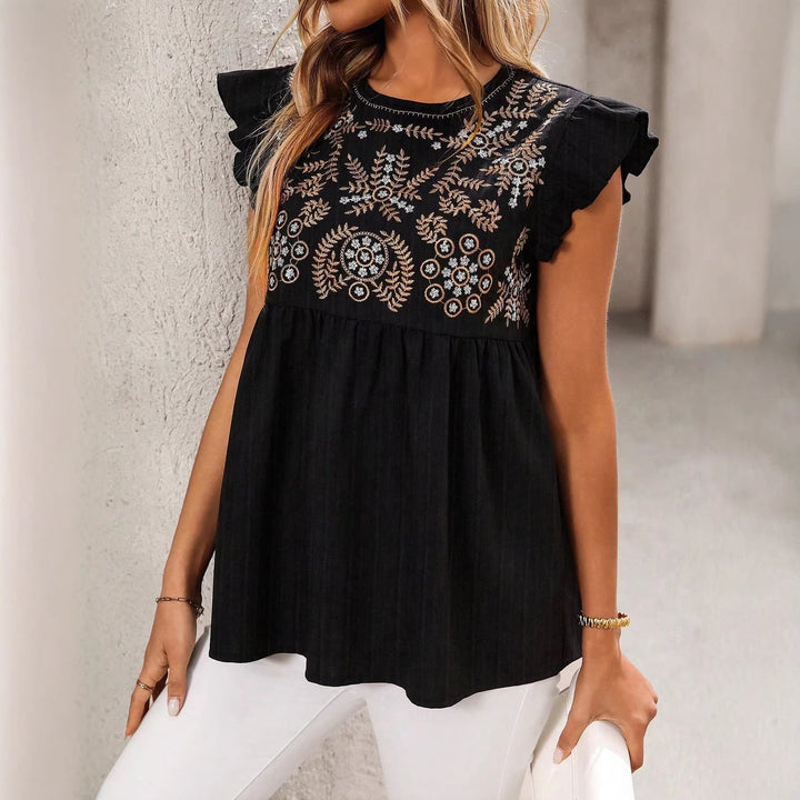 Boho Chic Damen Top: Kurzärmeliges Babydoll-Modell mit floraler Stickerei und Rüschen für Freizeit.