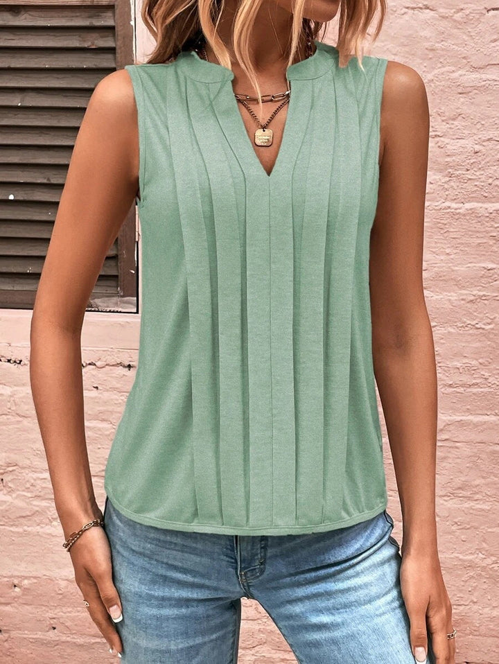 Stilvolles Damen Oberteil, ärmellos, mit V-Ausschnitt und eleganten Falten. Ideal für Büro oder besondere Anlässe.
