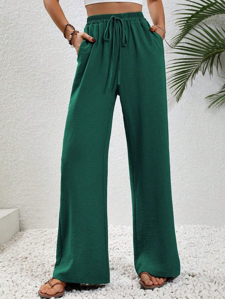 Modische Damenhose in Leinenoptik, weit geschnitten, mit Elastikbund für lässige Eleganz.