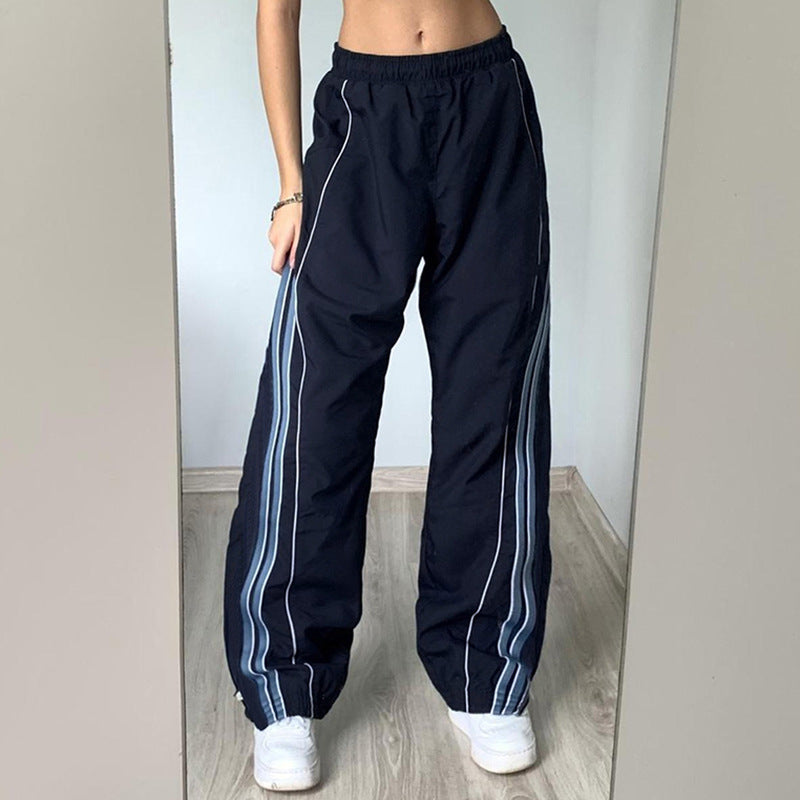 Marineblaue Damen Sporthose mit hohem Bund und weißen Kontraststreifen. Ideal für Fitness, Yoga & Training.