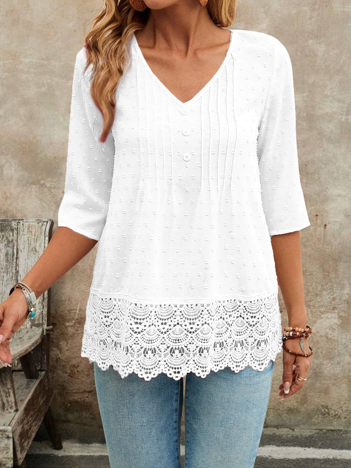 Schmeichelhafte Damen Tunika Bluse mit 3/4 Ärmeln, V-Ausschnitt und eleganten Details für alle Anlässe.
