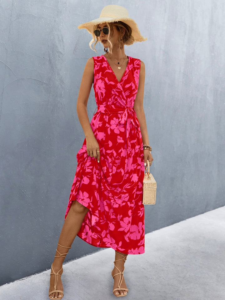 Damen Wickelkleid mit auffälligem floralem Muster, ärmellos & mit eleganter Raffung.