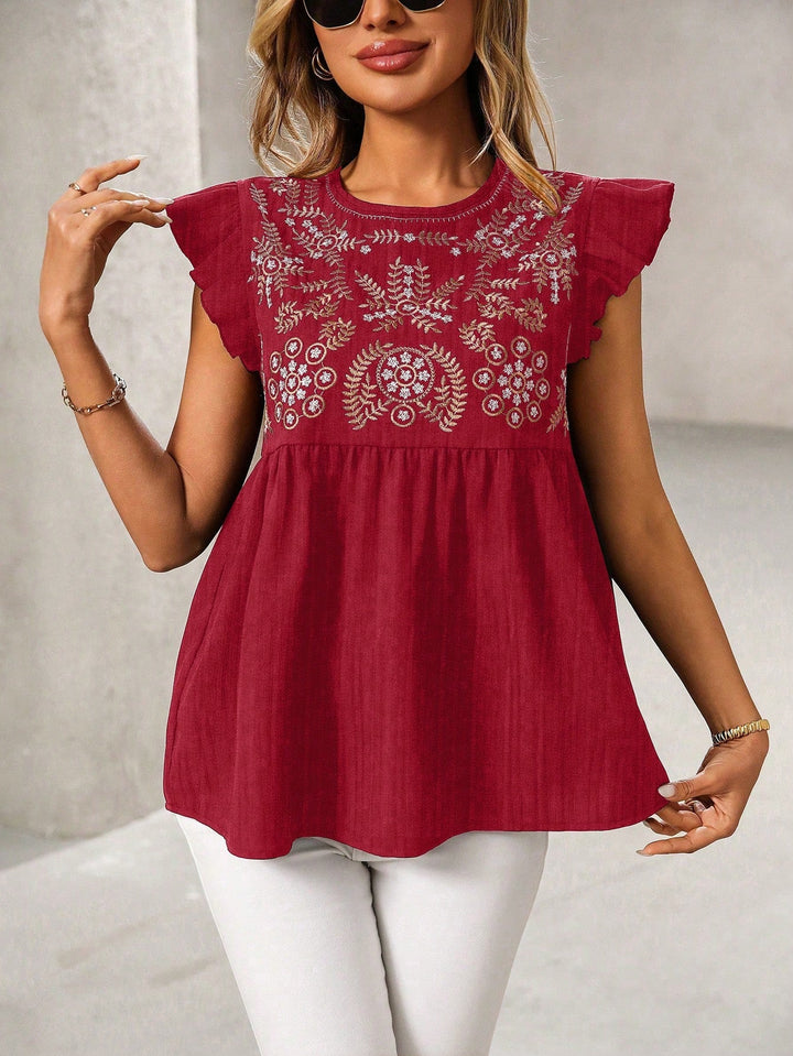 Trendiges Damen Babydoll-Top mit aufwendiger Stickerei und zarten Rüschenärmeln, Boho-Stil.
