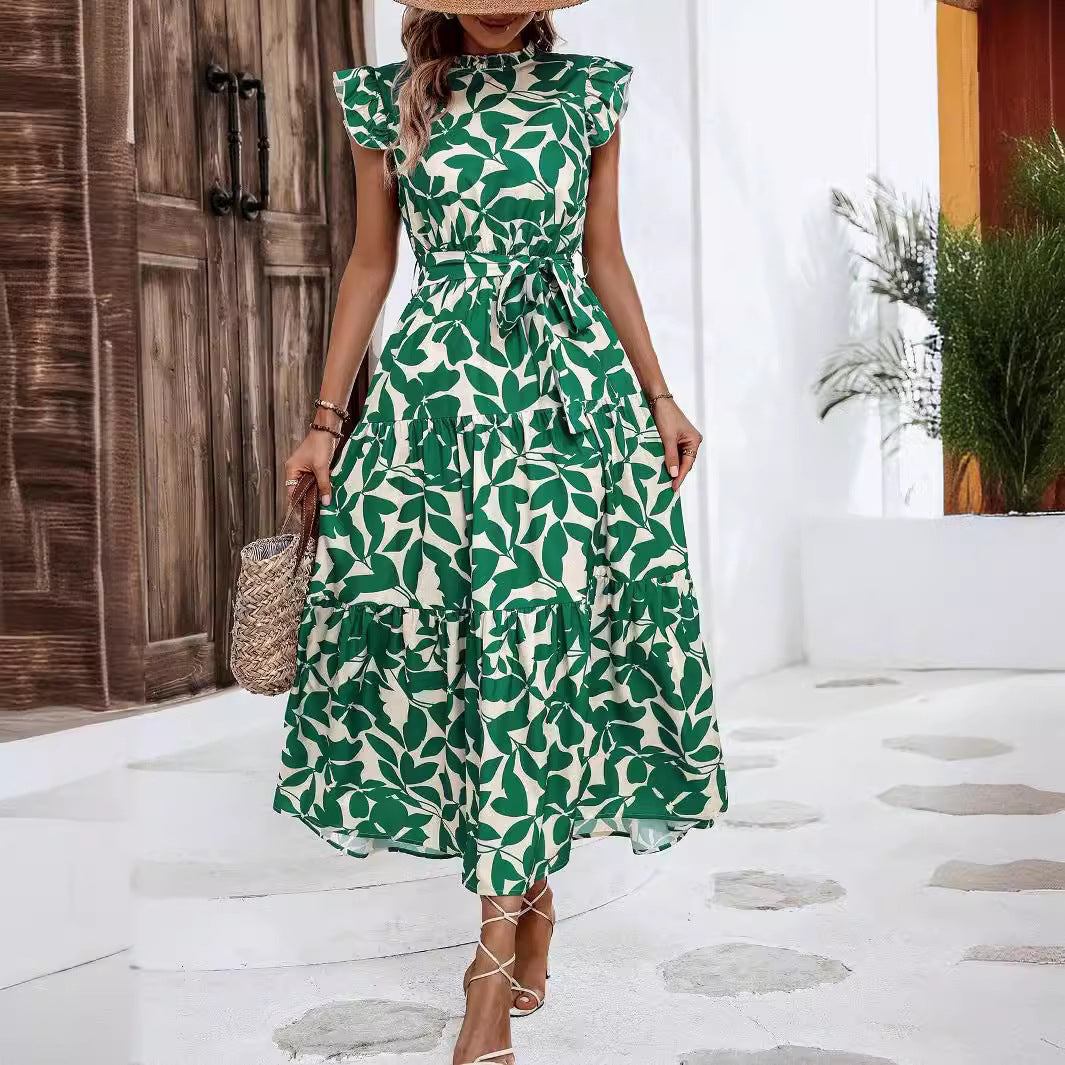 Schickes Damen Taillenkleid: Midikleid mit Blumenmuster, modischem Stufenrock und charmanten Rüschenärmeln.