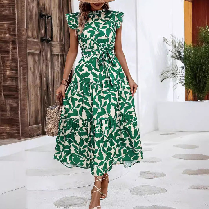 Schickes Damen Taillenkleid: Midikleid mit Blumenmuster, modischem Stufenrock und charmanten Rüschenärmeln.