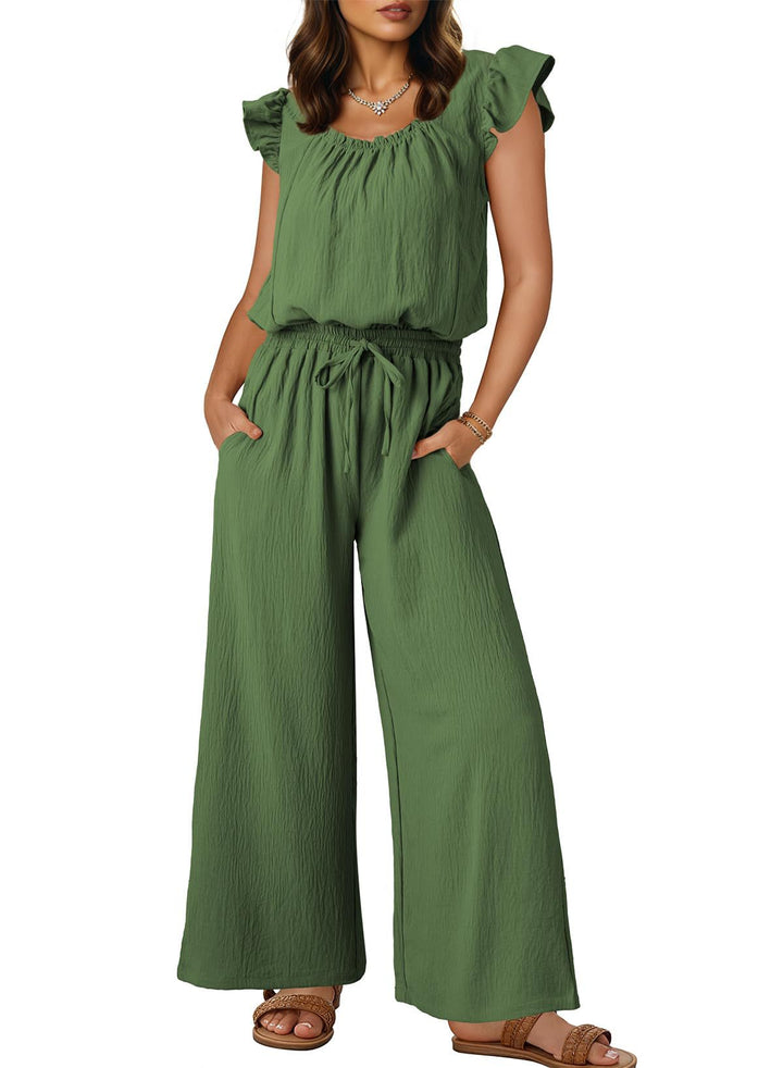 Entspannter Damen Crinkle-Jumpsuit, locker geschnitten mit weitem Bein & Rüschen, ideal für den Urlaub.