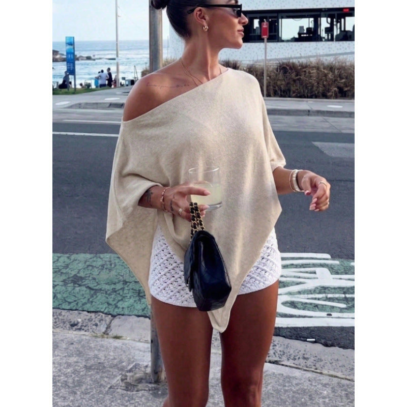 Trendige Frauenkleidung: Asymmetrisches Off-Shoulder Poncho-Top, elegant und bequem für jeden Anlass.