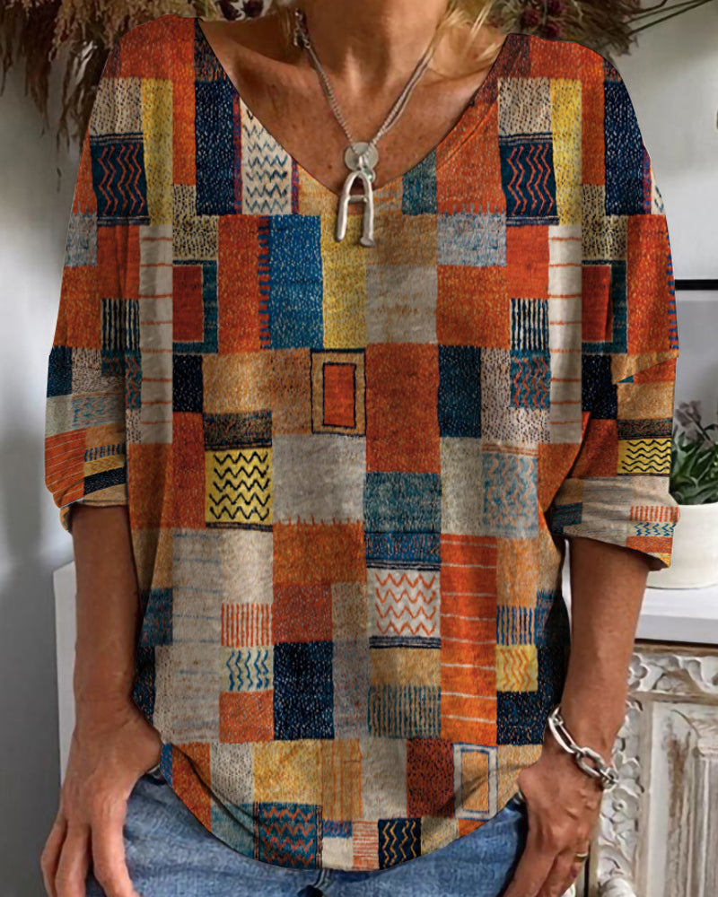 Stylisches Damen Patchwork-Oberteil mit V-Ausschnitt in Orange für den Sommer. Perfekt für Freizeitmode.