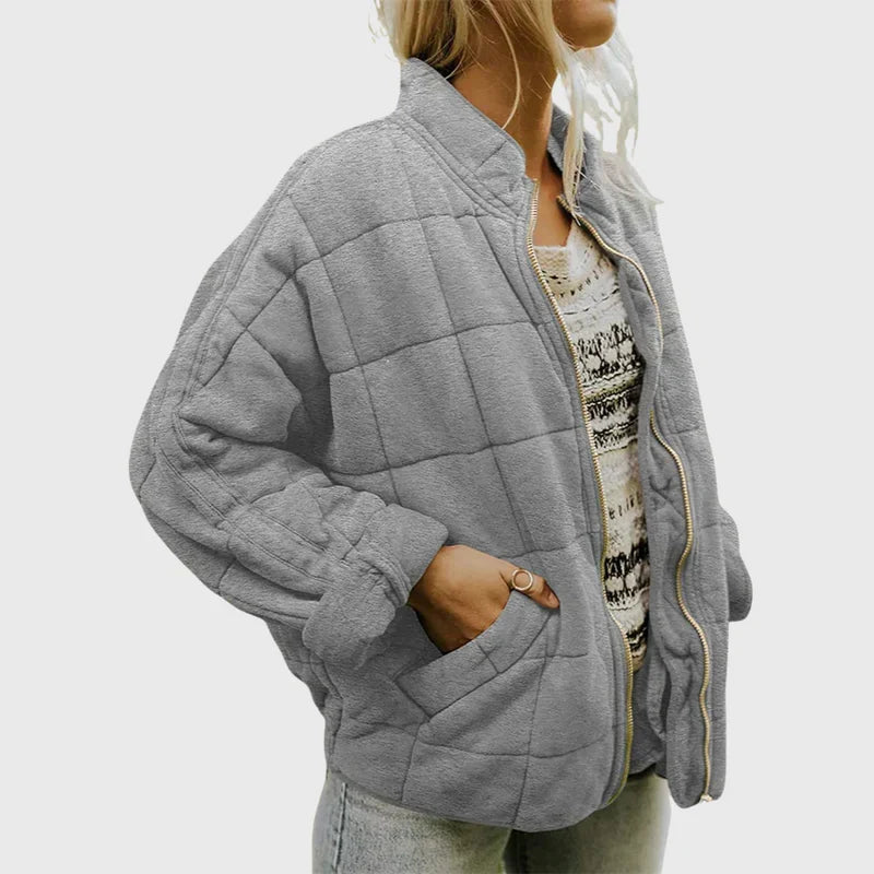 Lange Damen Herbstjacke im eleganten, strukturierten Schnitt; vielseitige Frauenbekleidung für kühle Tage.