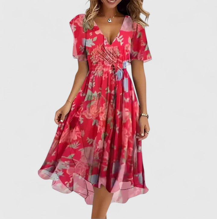 Damen Kurzkleid mit lebhaftem floralen Muster, figurbetonter Slim Fit Passform und charmanten Schmetterlingsärmeln.