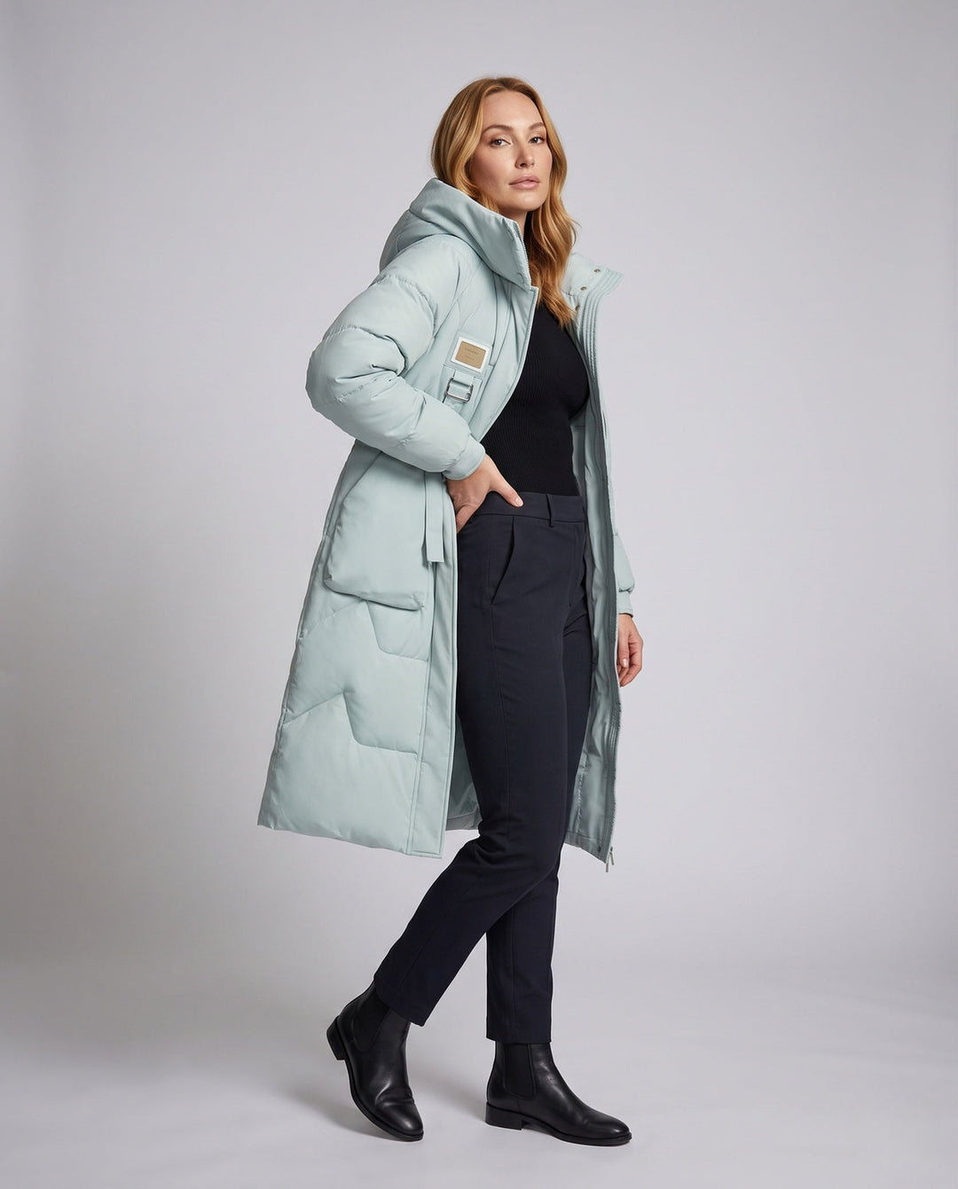 Damen lange Thermo Steppjacke mit Oversize Kapuze für warmen Kälteschutz im Winter.