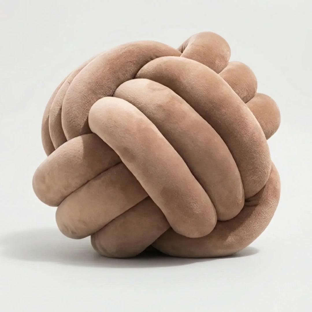Weiches & gemütliches Rundkissen mit Knotendesign. Perfektes Dekokissen für Entspannung & Stil im Wohnzimmer.