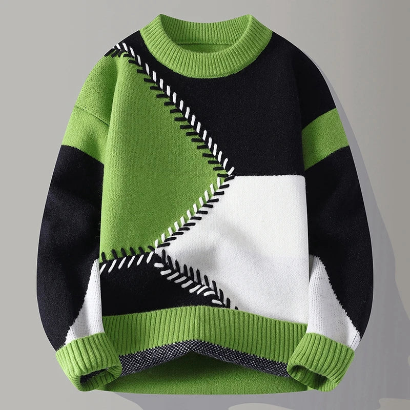 Trendiger Herrenpullover für den Winter: Geometrisches Color-Blocking, warmer Strick und gerippter Saum.