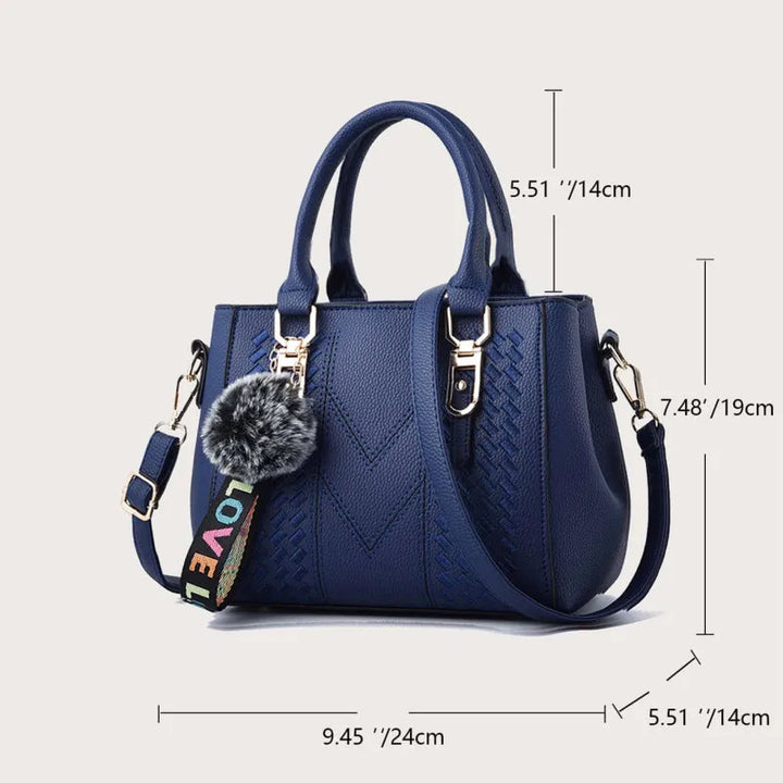 Graue Damen Schultertasche aus Leder mit einzigartiger Stickerei; elegantes und vielseitiges Accessoire.