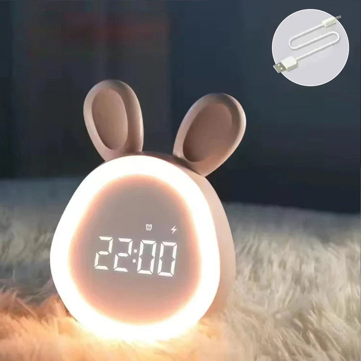Rosa Kinder LED Wecker in Hasenform mit sanftem Nachtlicht, ideal fürs Kinderzimmer.