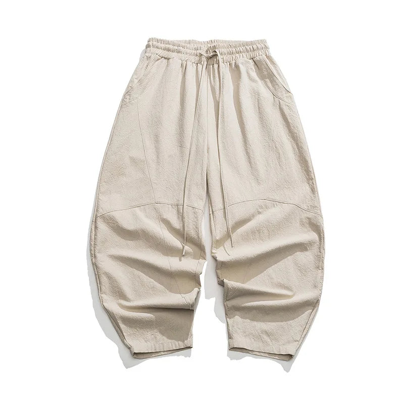 Elegante Beige Weithose für Herren. Elastischer Bund, bequemer Schnitt. Modische Freizeithose.