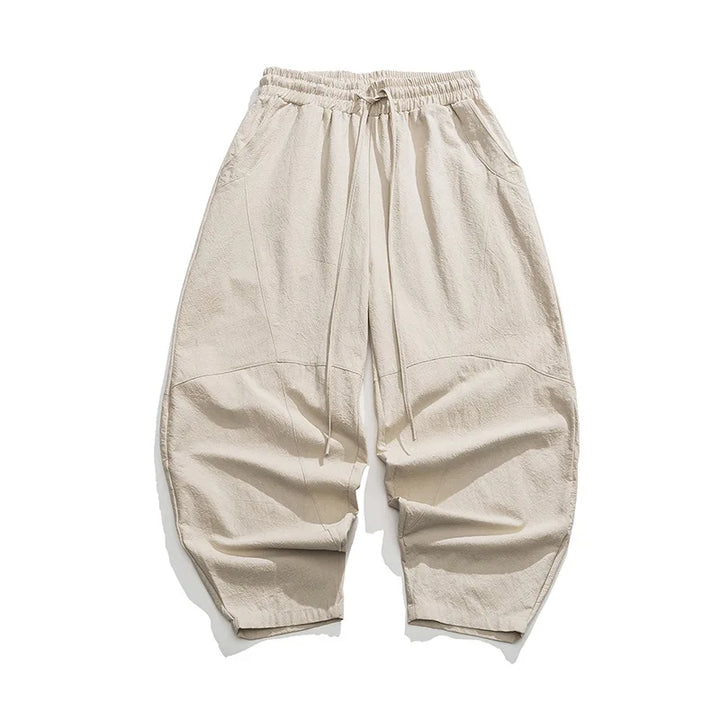 Elegante Beige Weithose für Herren. Elastischer Bund, bequemer Schnitt. Modische Freizeithose.