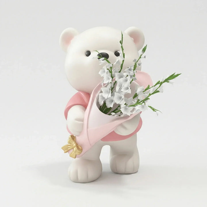 Süße Teddy Dekofigur hält Blumenstrauß. Perfekt als Akzent für gemütliche Wohnräume und als Geschenk.